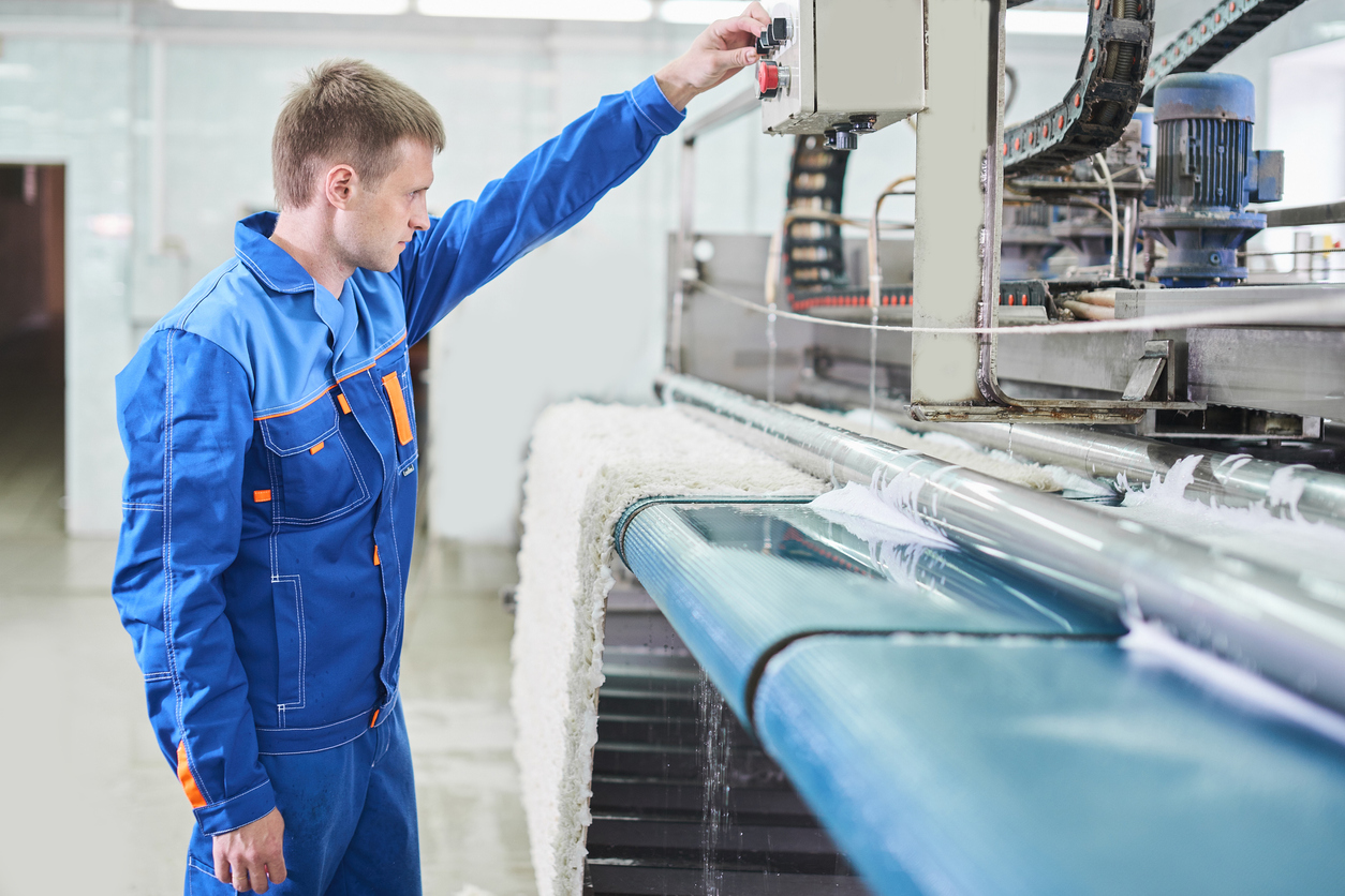 The employee works on the machine for carpet cleaning