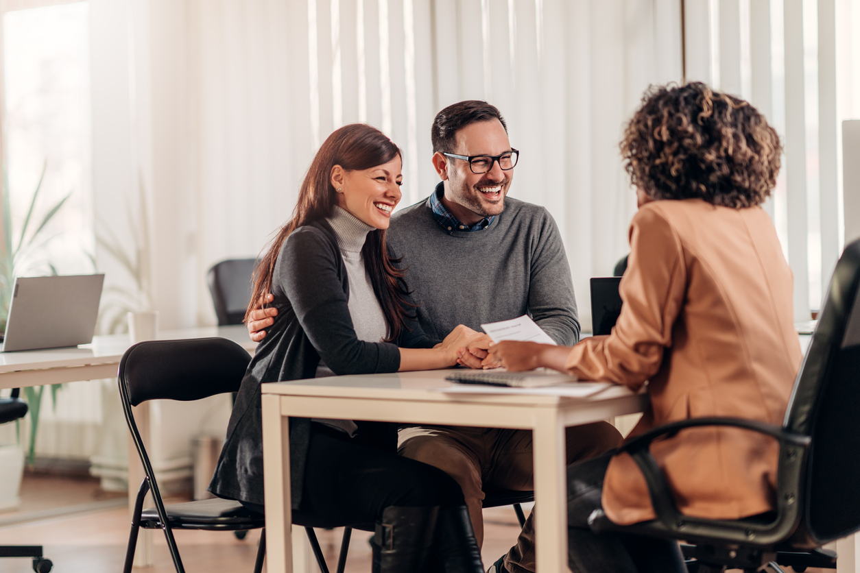 Insurance broker and customers at a consultation