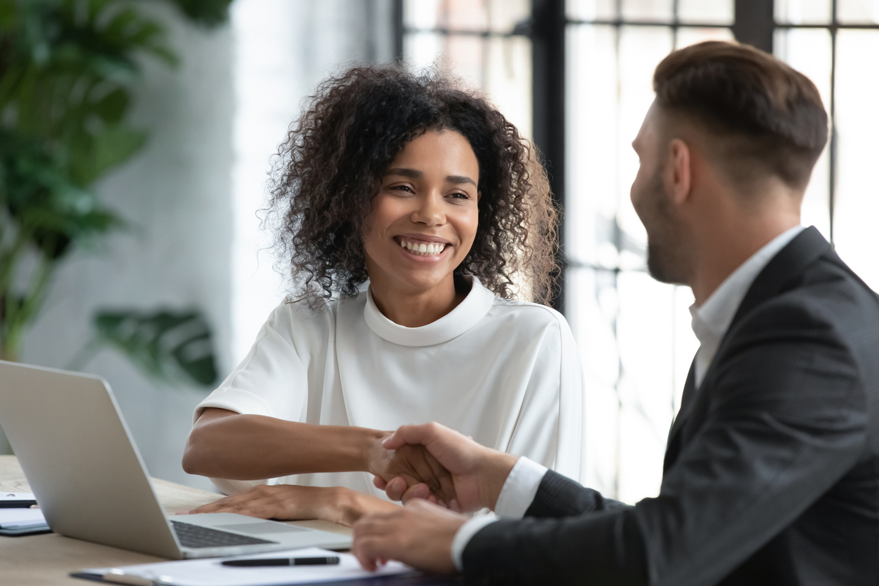 businesswoman advisor broker shaking client customer hand at meeting, making great deal after successful negotiations, executive mentor greeting new worker intern