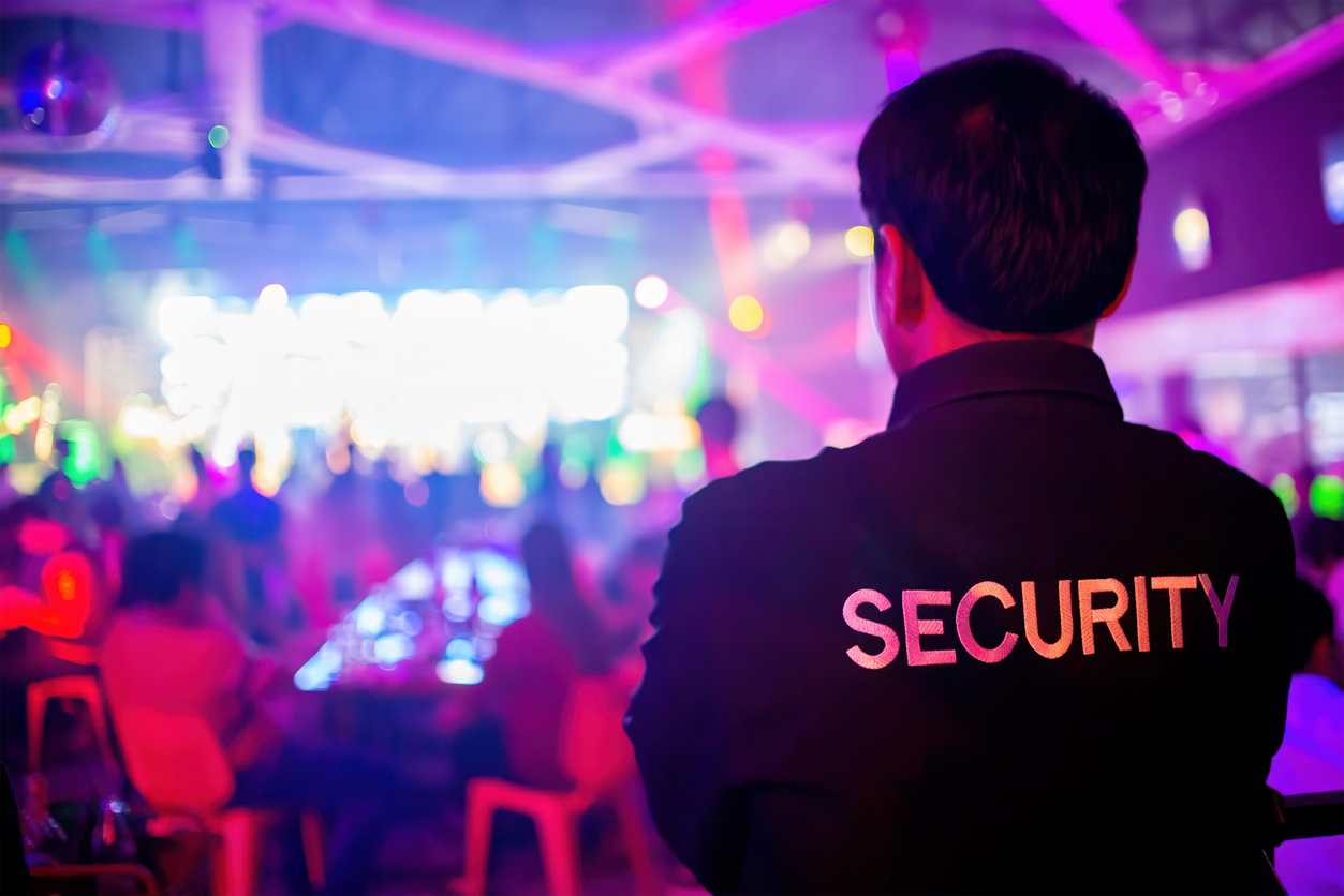 Security guard are regulating the situation of safety in an event concert in a nightclub.