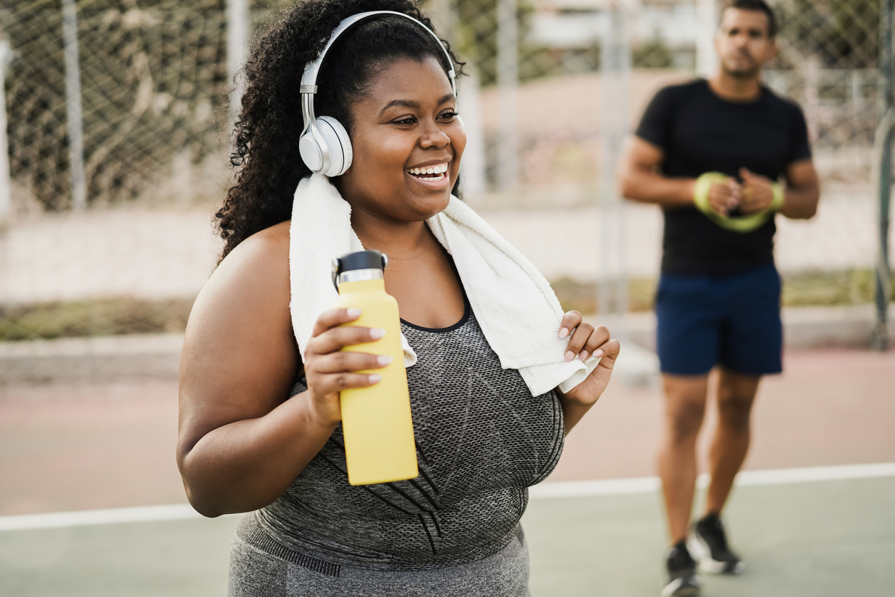 Woman doing workout morning routine outdoor at city park 